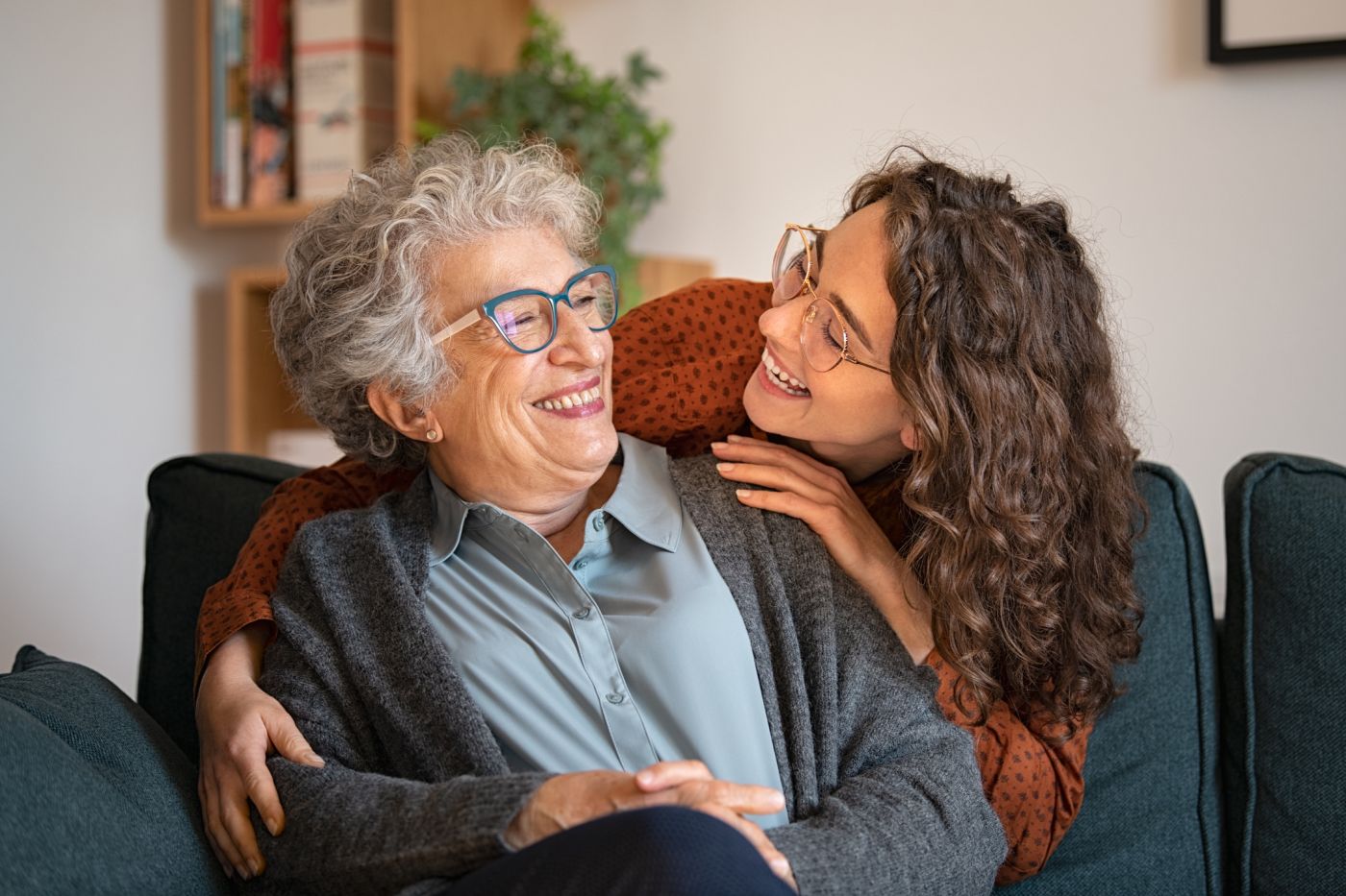 Older lady and younger lady hugging